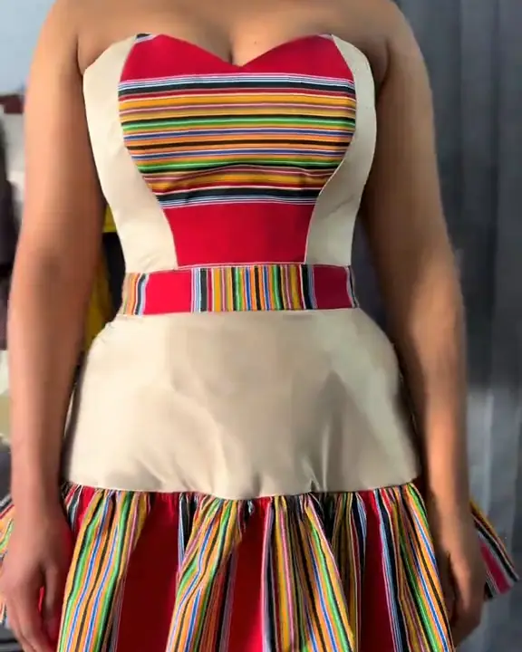 Strapless dress with traditional striped bands